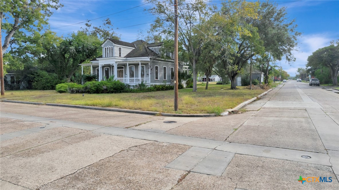 502 North Liberty Street Victoria, TX 77901 - Photo 10 of 17 a view of a house with a garden and pathway