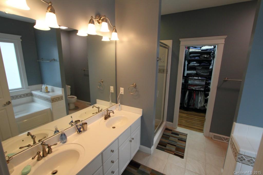 112 View Lake Street Davidson, NC 28036 - Photo 11 of 24 a bathroom with a double vanity sink and a mirror