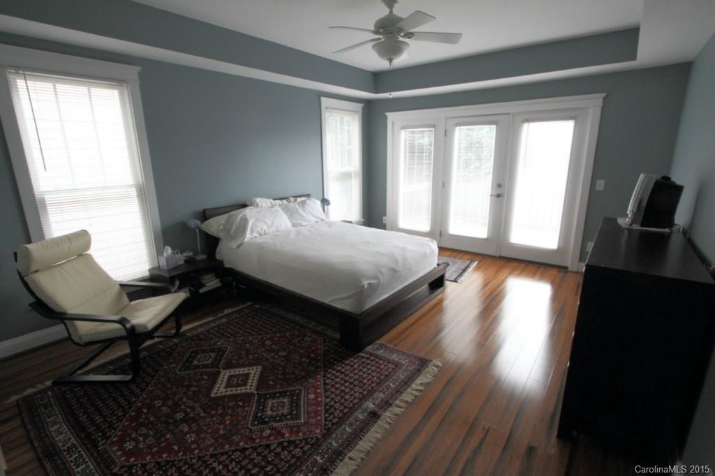 112 View Lake Street Davidson, NC 28036 - Photo 12 of 24 a bedroom with a bed window and wooden floor