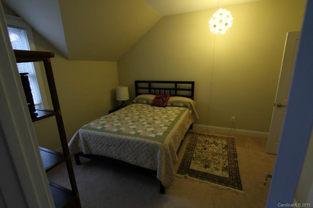 112 View Lake Street Davidson, NC 28036 - Photo 23 of 24 a bed sitting in a bedroom next to a window