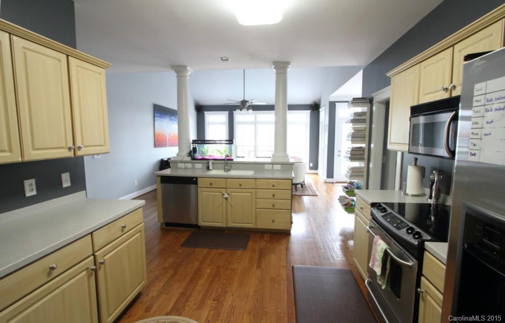 112 View Lake Street Davidson, NC 28036 - Photo 7 of 24 a kitchen with a sink stove and refrigerator