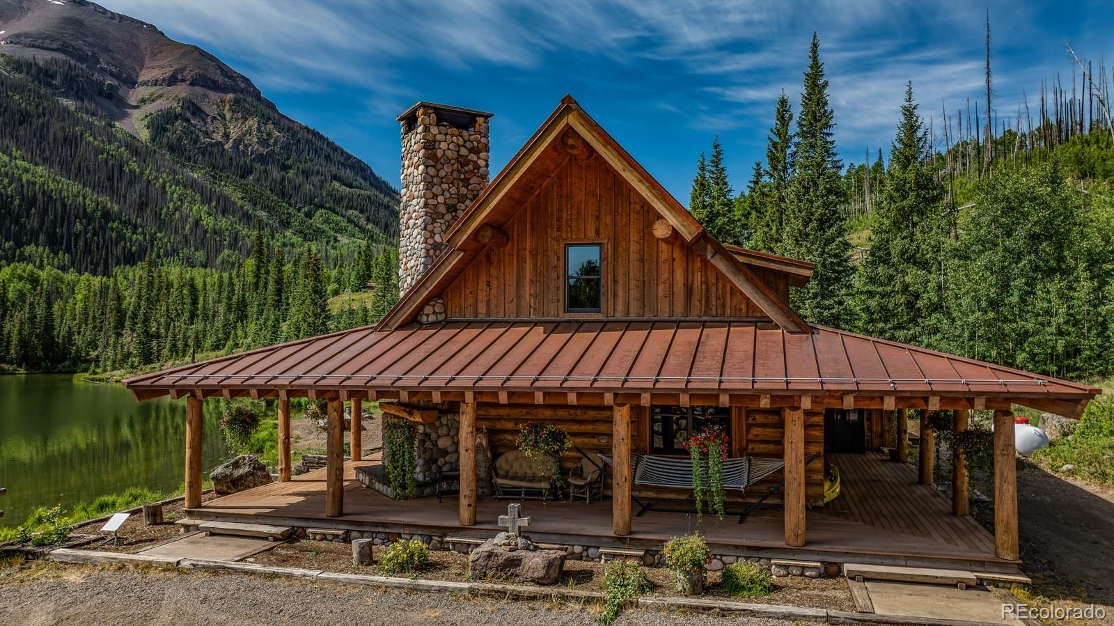 2418 Forest Road Creede, CO 81130 - Photo 25 of 50 a front view of a house with garden