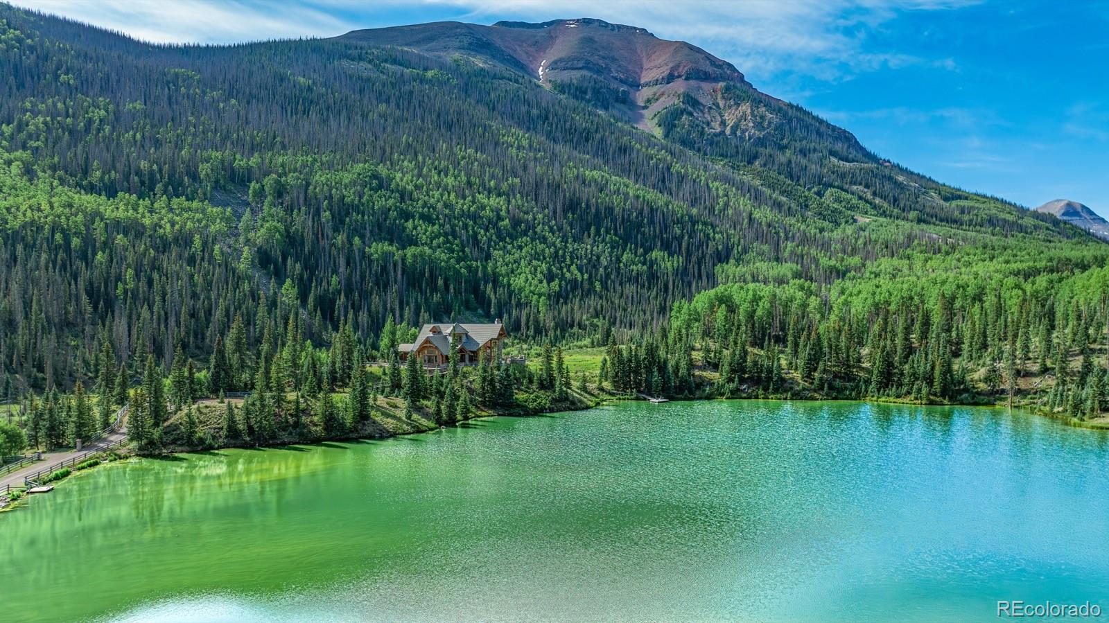 2418 Forest Road Creede, CO 81130 - Photo 46 of 50 a view of a garden with a lake