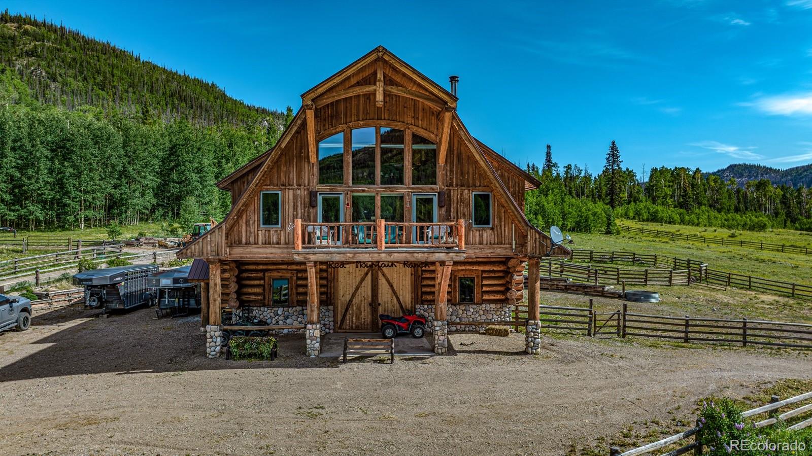 2418 Forest Road Creede, CO 81130 - Photo 47 of 50 an outdoor view of a house with a yard