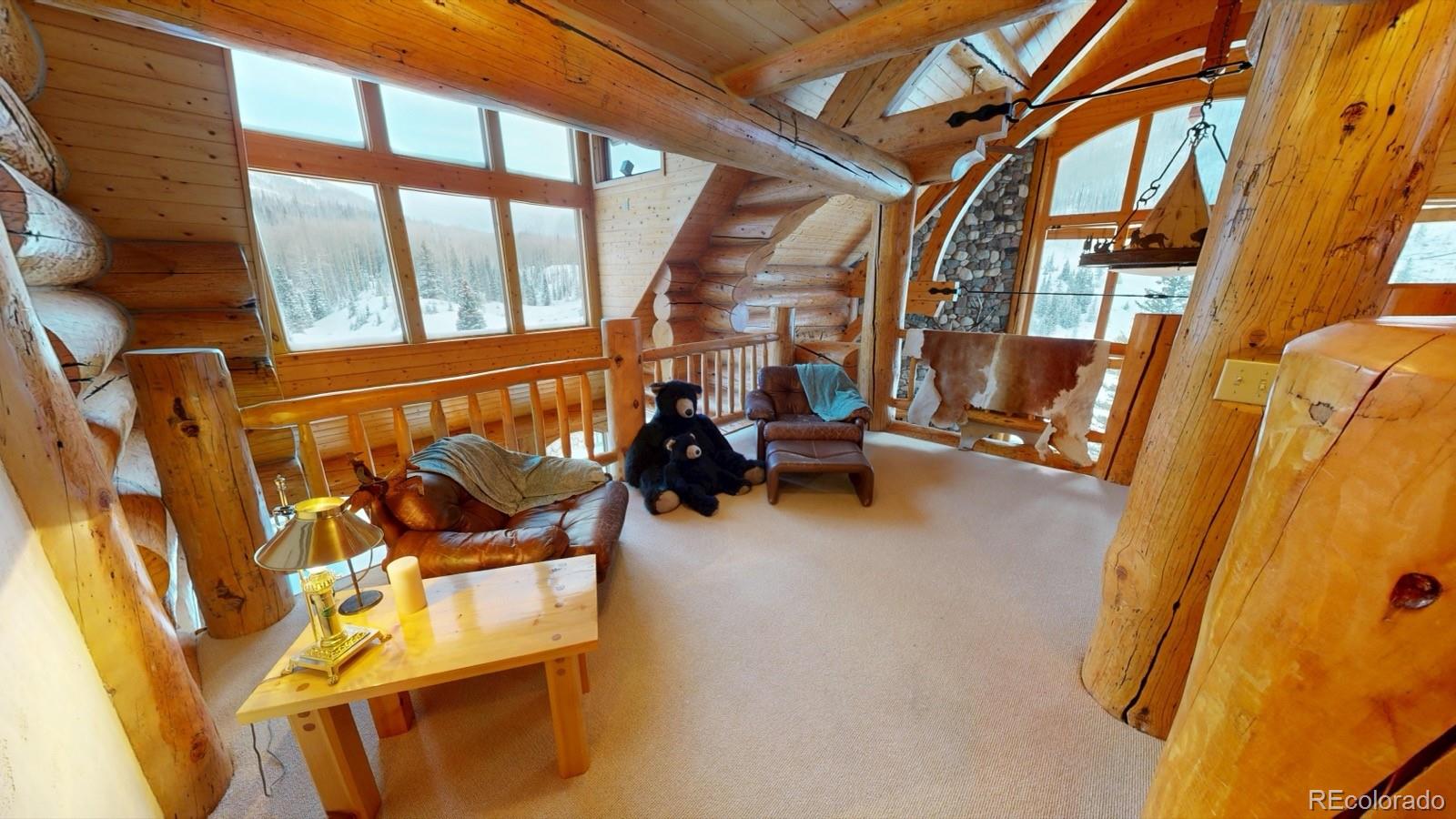 2418 Forest Road Creede, CO 81130 - Photo 6 of 50 a view of an chairs and table in the balcony
