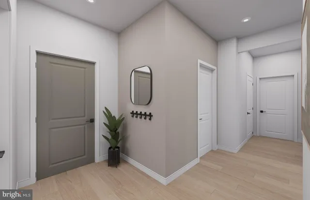 a bathroom with a toilet sink vanity and mirror