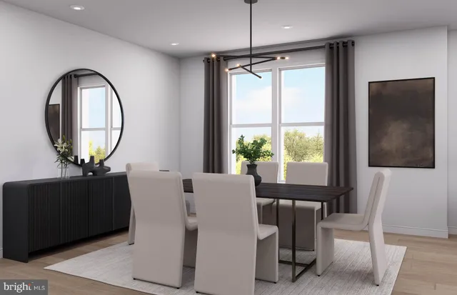 a kitchen with stainless steel appliances kitchen island granite countertop a table and chairs in it