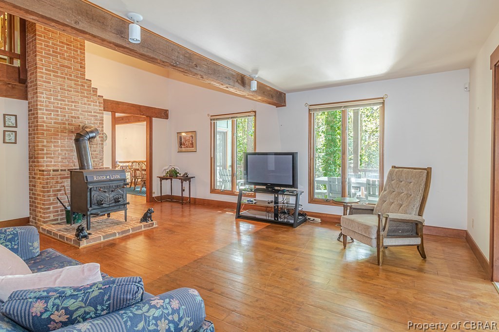 131 Ewell Road Lancaster, VA 22503 - Photo 23 of 50 a living room with furniture a pool table and a fireplace