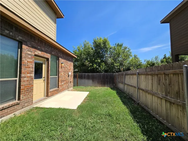 a view of a backyard with plants
