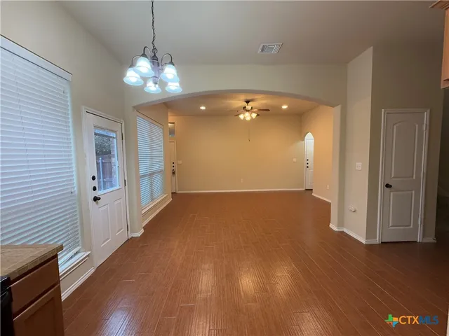 a view of a livingroom with wooden floor