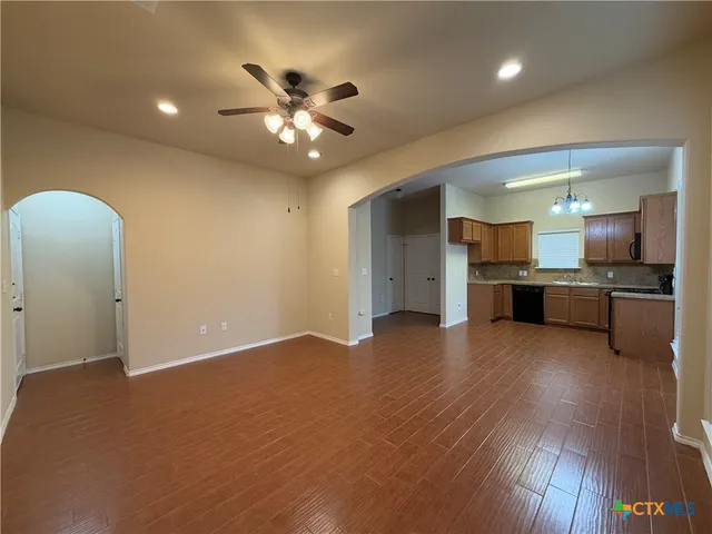 a view of a kitchen with a sink and a living room