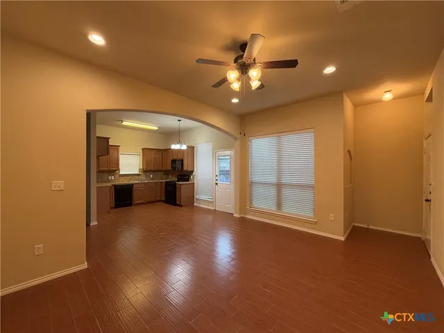 a view of a livingroom with a kitchen