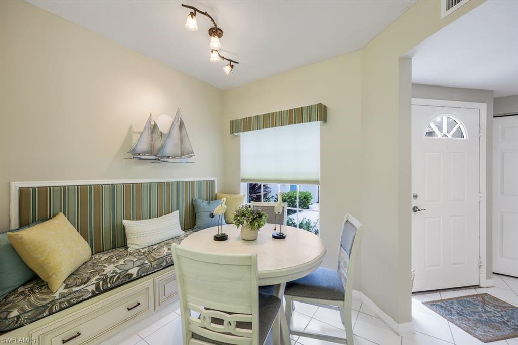 23730 Eddystone Road, Unit 5102 Bonita Springs, FL 34135 - Photo 13 of 24 a living room with furniture and a table