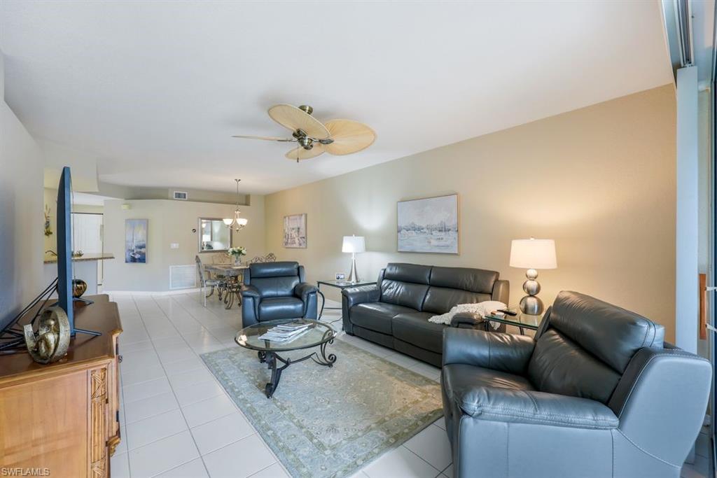 23730 Eddystone Road, Unit 5102 Bonita Springs, FL 34135 - Photo 9 of 24 a living room with furniture and a couch