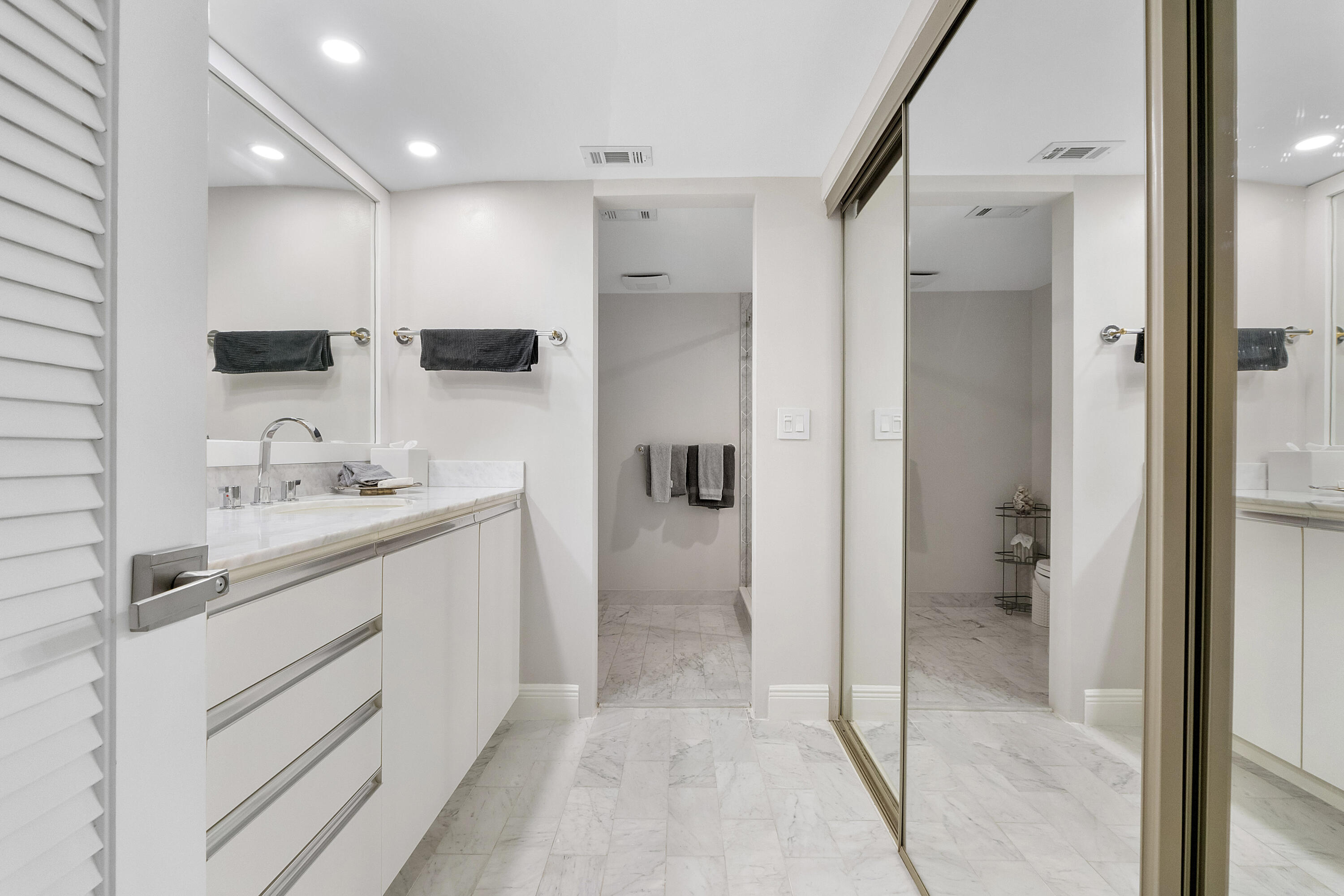 501 North Riverside Drive, Unit 203 Pompano Beach, FL 33062 - Photo 12 of 35 a bathroom with a sink a toilet and shower