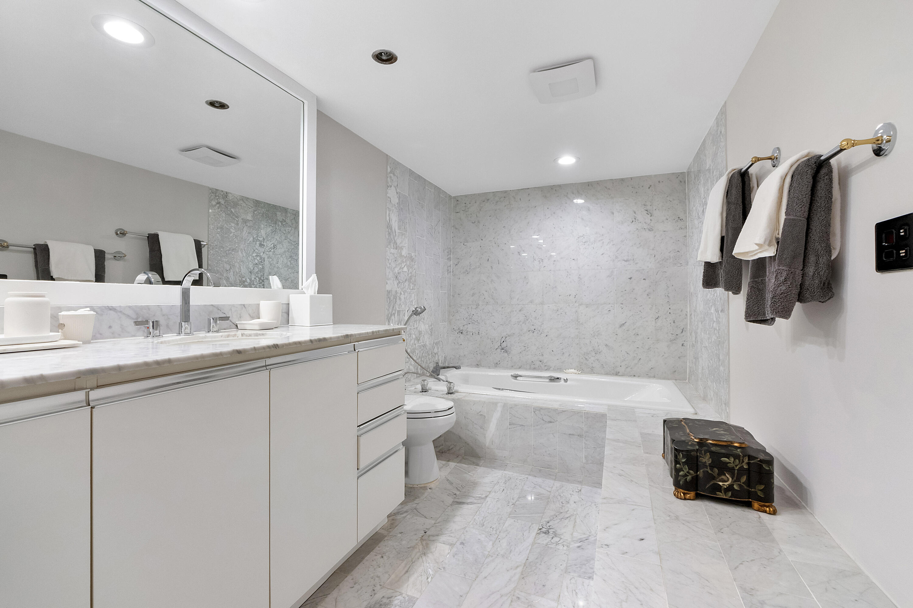 501 North Riverside Drive, Unit 203 Pompano Beach, FL 33062 - Photo 18 of 35 a bathroom with a double vanity sink a mirror a bathtub and shower