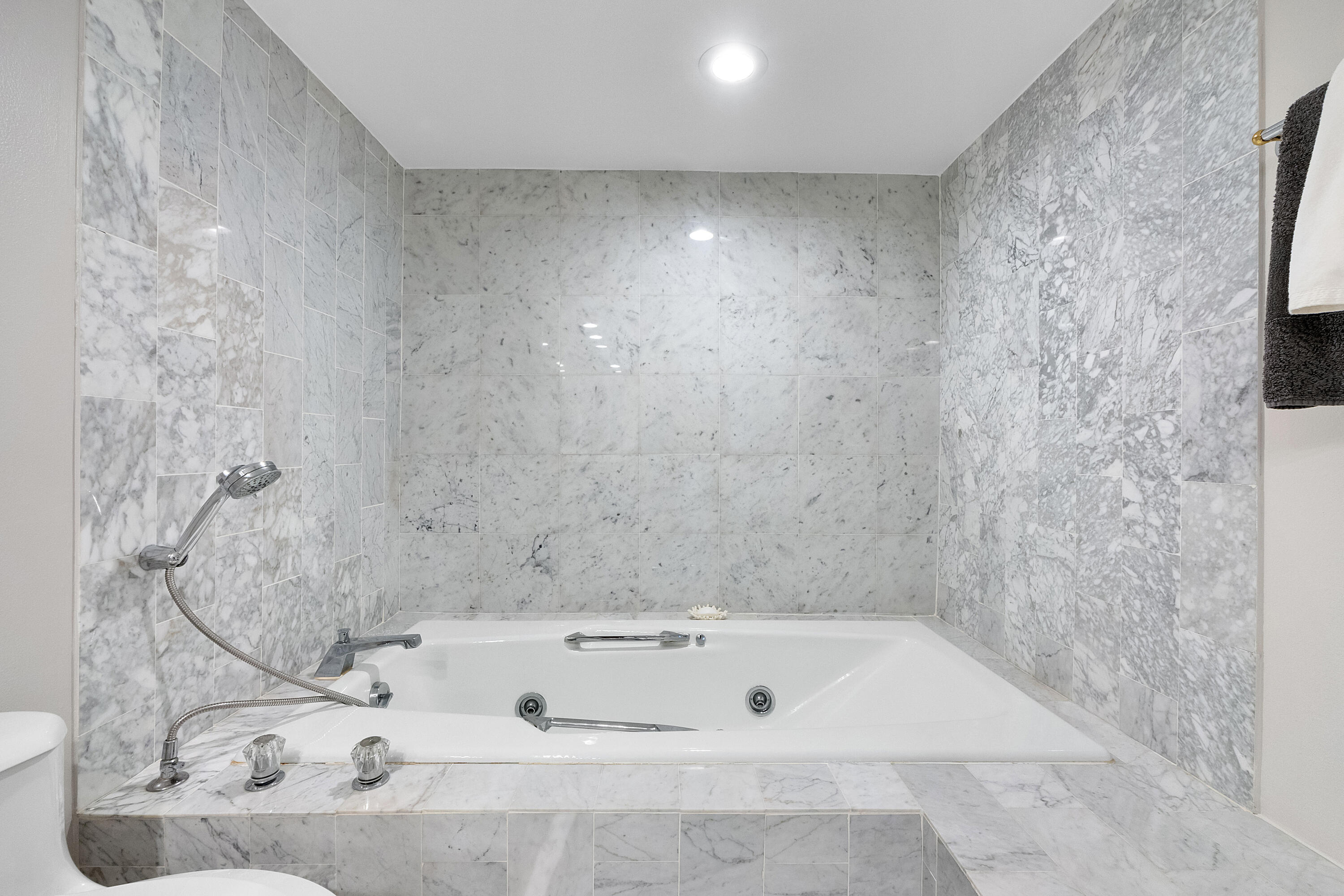501 North Riverside Drive, Unit 203 Pompano Beach, FL 33062 - Photo 19 of 35 a bath tub sitting in a bathroom and sink