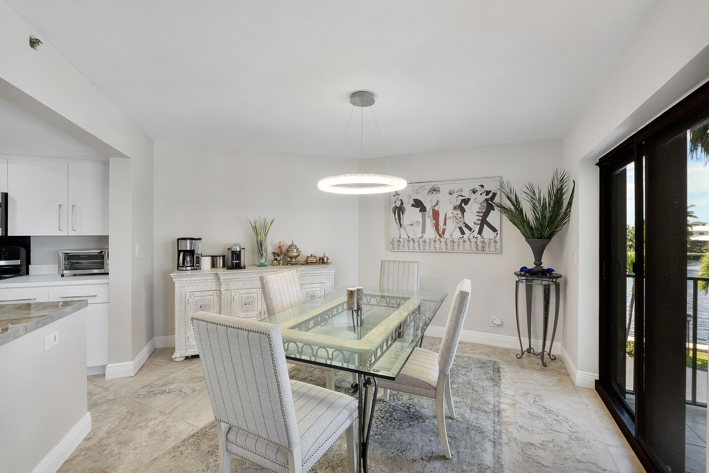 501 North Riverside Drive, Unit 203 Pompano Beach, FL 33062 - Photo 26 of 35 a view of a dining room with furniture and a kitchen