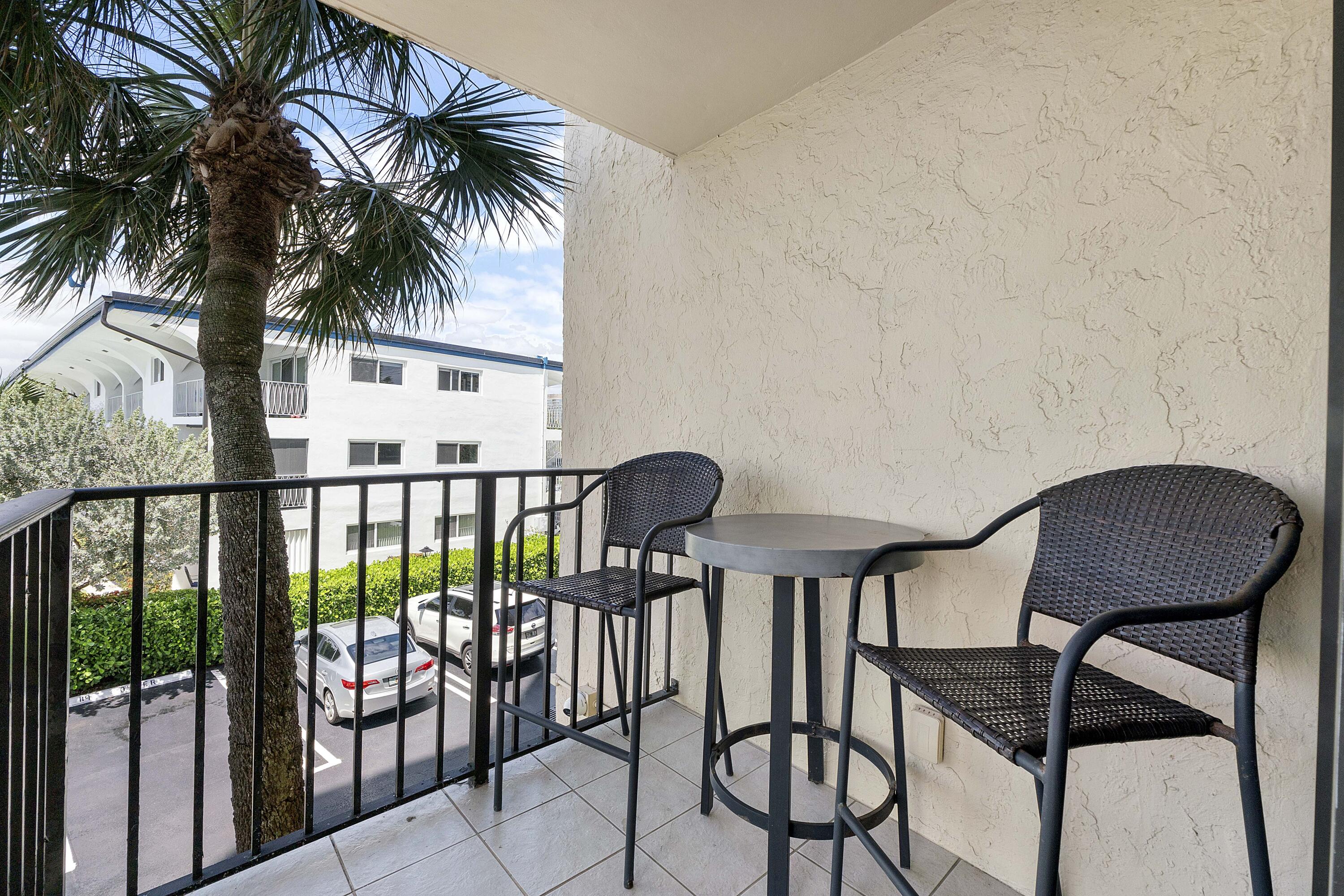 501 North Riverside Drive, Unit 203 Pompano Beach, FL 33062 - Photo 28 of 35 a view of a chairs and table in the balcony