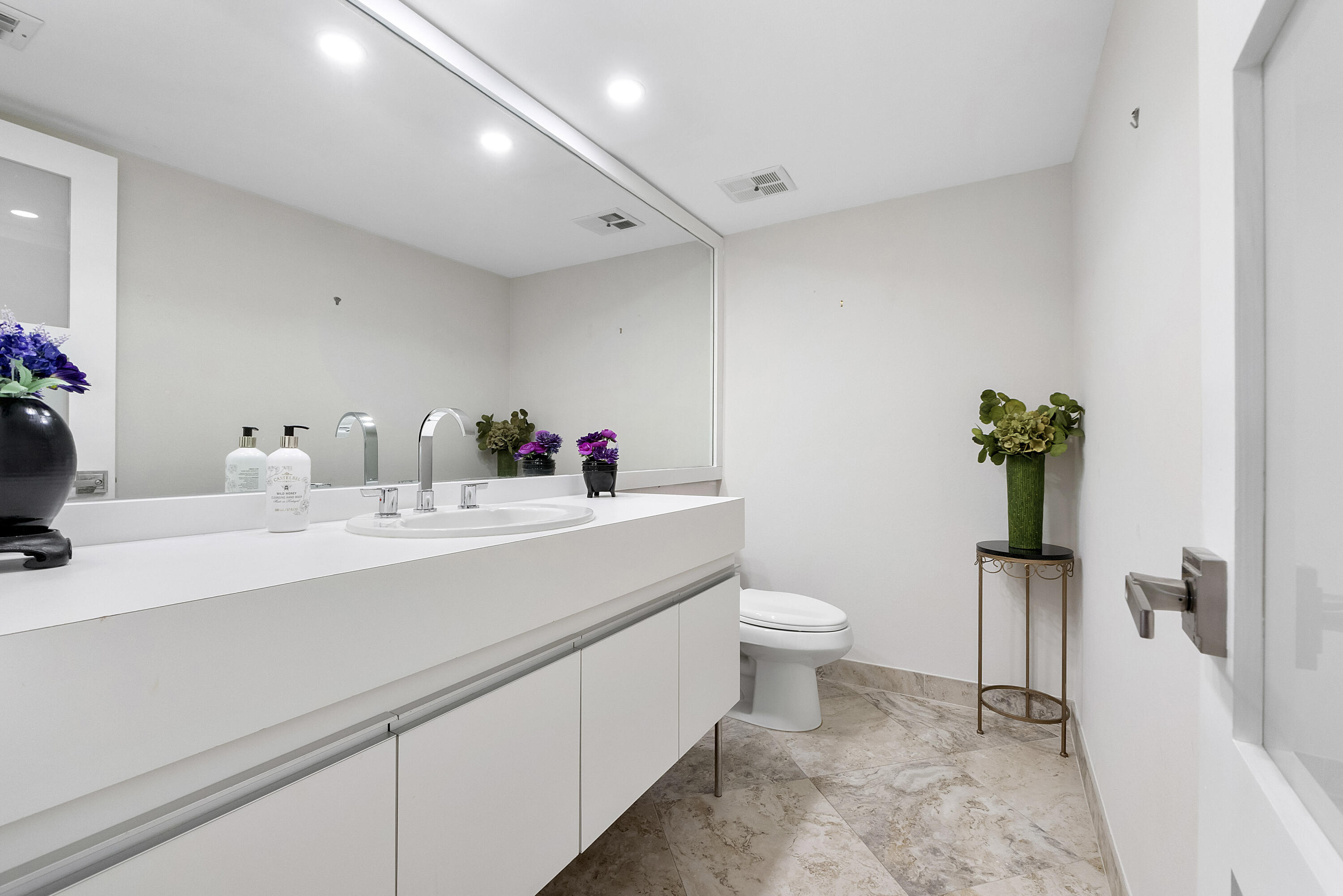 501 North Riverside Drive, Unit 203 Pompano Beach, FL 33062 - Photo 8 of 35 a bathroom with a sink toilet and shower