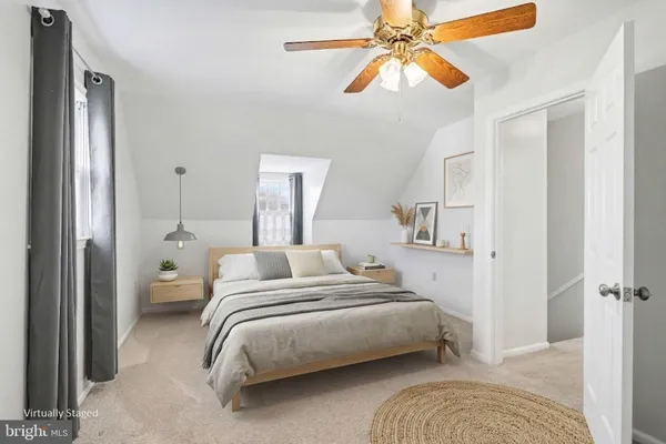 a bedroom with bed and a chandelier