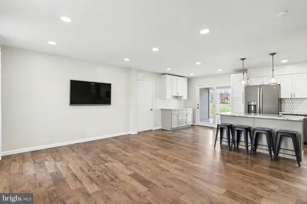 a view of kitchen with microwave and furniture