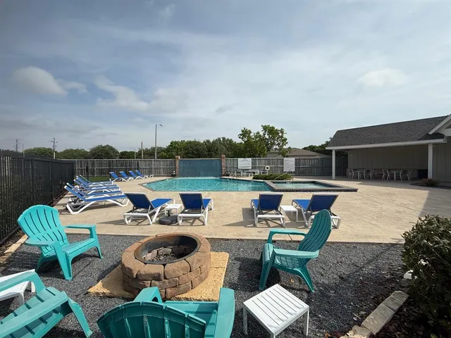 a terrace with outdoor seating and city view