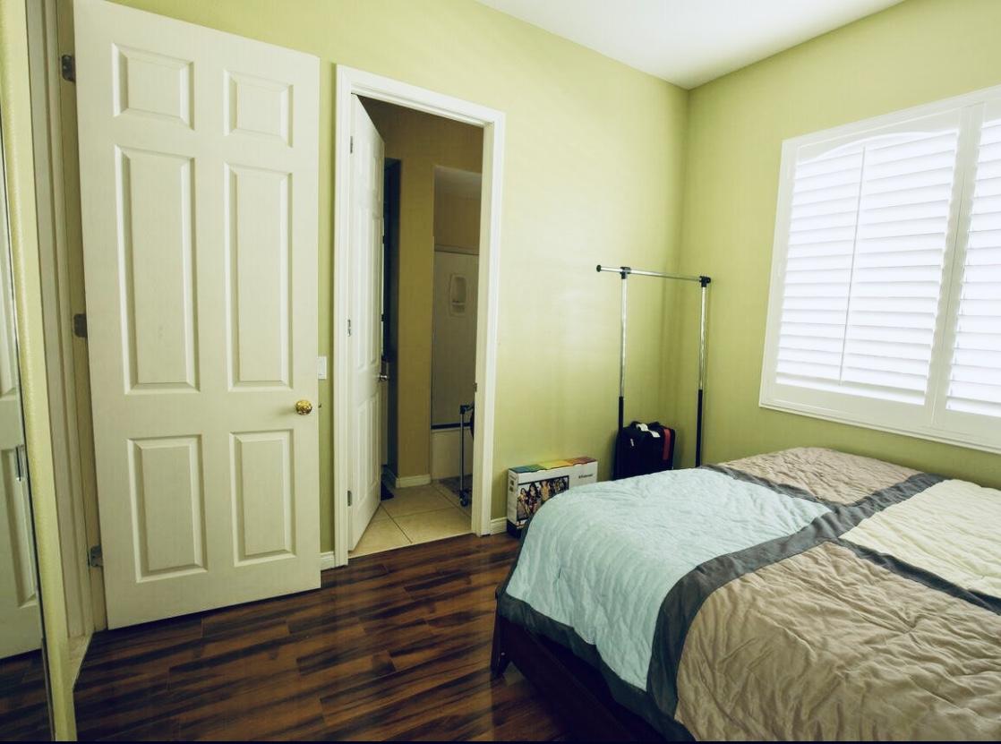 62 Victor Hugo Road Rancho Mirage, CA 92270 - Photo 12 of 14 a bedroom with a bed and wooden floor