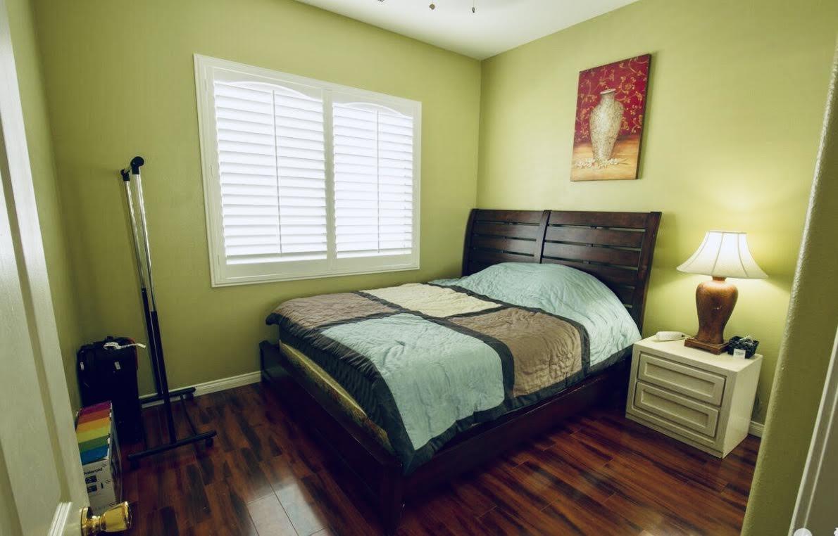 62 Victor Hugo Road Rancho Mirage, CA 92270 - Photo 14 of 14 a bedroom with a bed and wooden floor