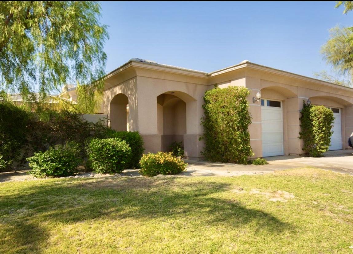 62 Victor Hugo Road Rancho Mirage, CA 92270 - Photo 3 of 14 a front view of a house with a yard