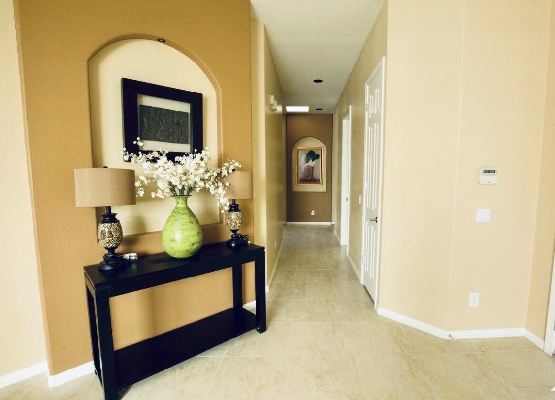 62 Victor Hugo Road Rancho Mirage, CA 92270 - Photo 5 of 14 a living room with furniture and a flat screen tv