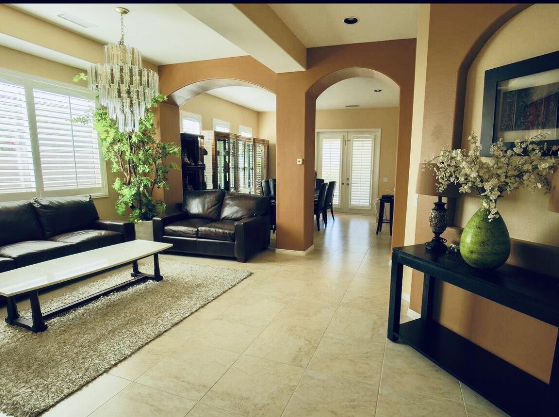 62 Victor Hugo Road Rancho Mirage, CA 92270 - Photo 6 of 14 a living room with furniture and flowers