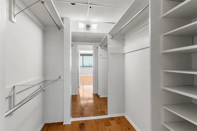 a bathroom with a sink double vanity mirror and a bathtub