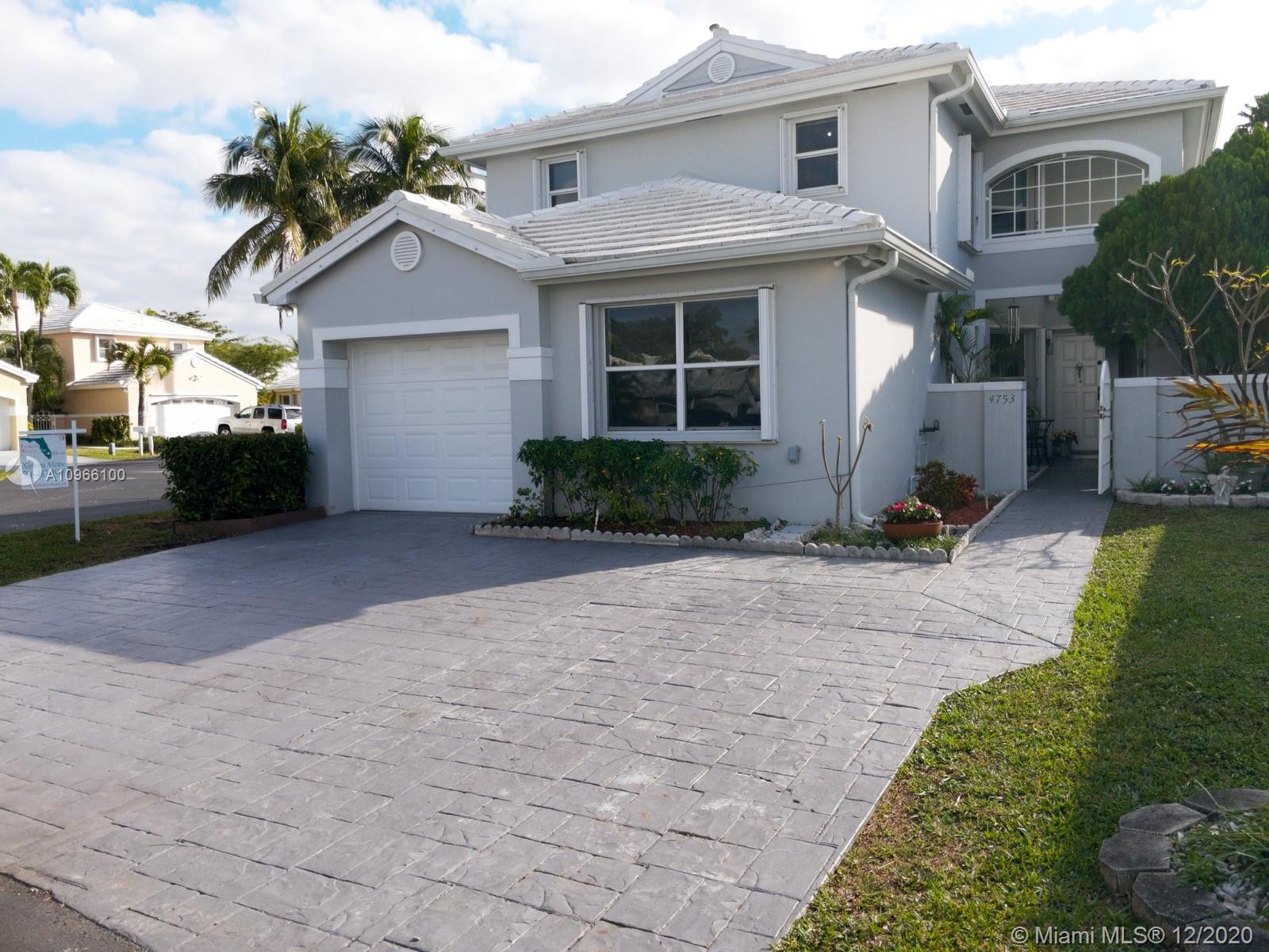 Corner home with extended driveway. 