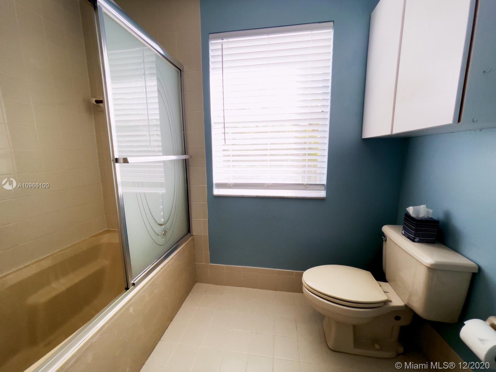 4753 Southwest 154th Court Miami, FL 33185 - Photo 20 of 27 Shower/tub combination in master bathroom and lot of light.