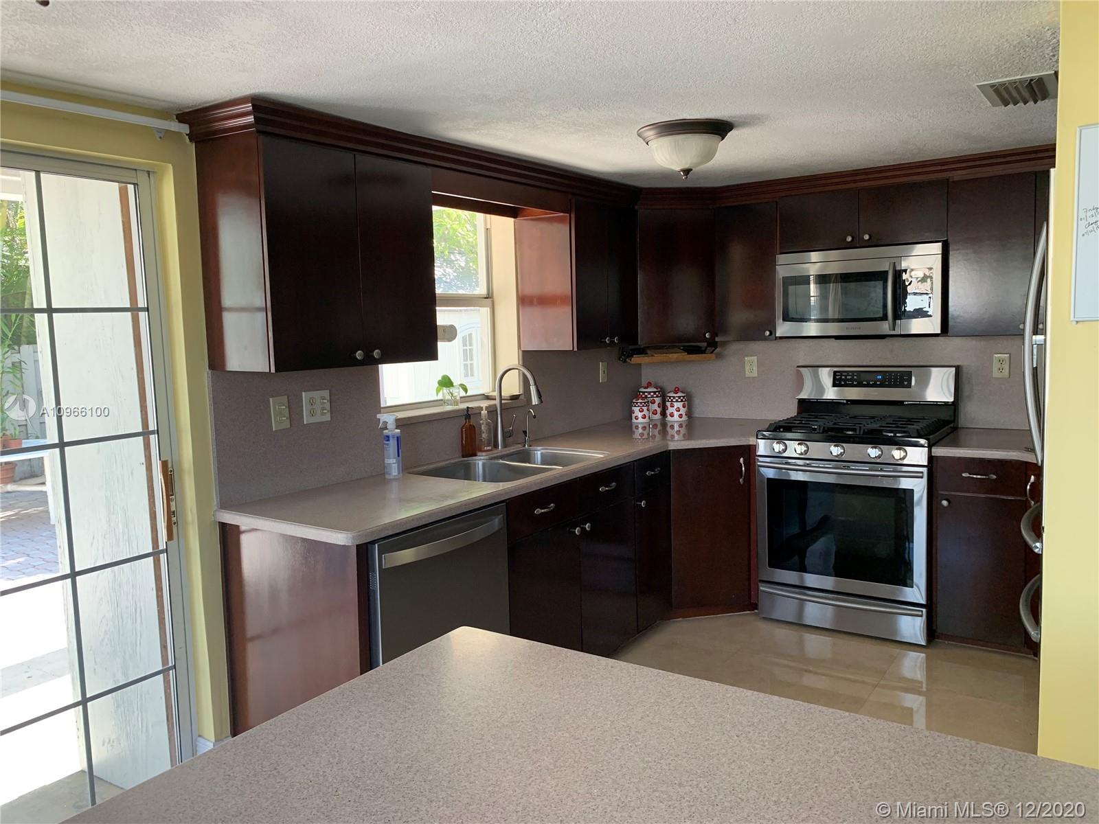 4753 Southwest 154th Court Miami, FL 33185 - Photo 3 of 27 Living room with high ceilings... lot of light here. Also note the porcelain tile.