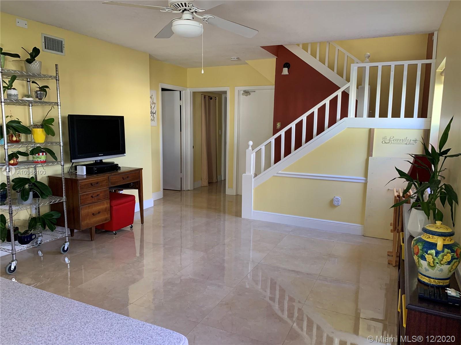 4753 Southwest 154th Court Miami, FL 33185 - Photo 9 of 27 Next to family room is a full bath and bedroom for those who prefer to stay on the first floor.