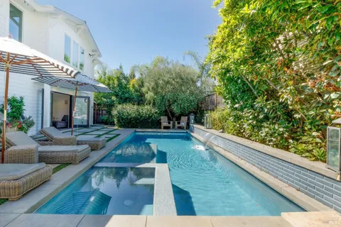 a view of a swimming pool with sitting area