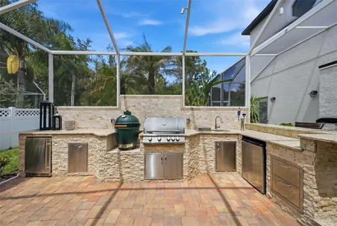 a kitchen with stainless steel appliances granite countertop a stove and a sink