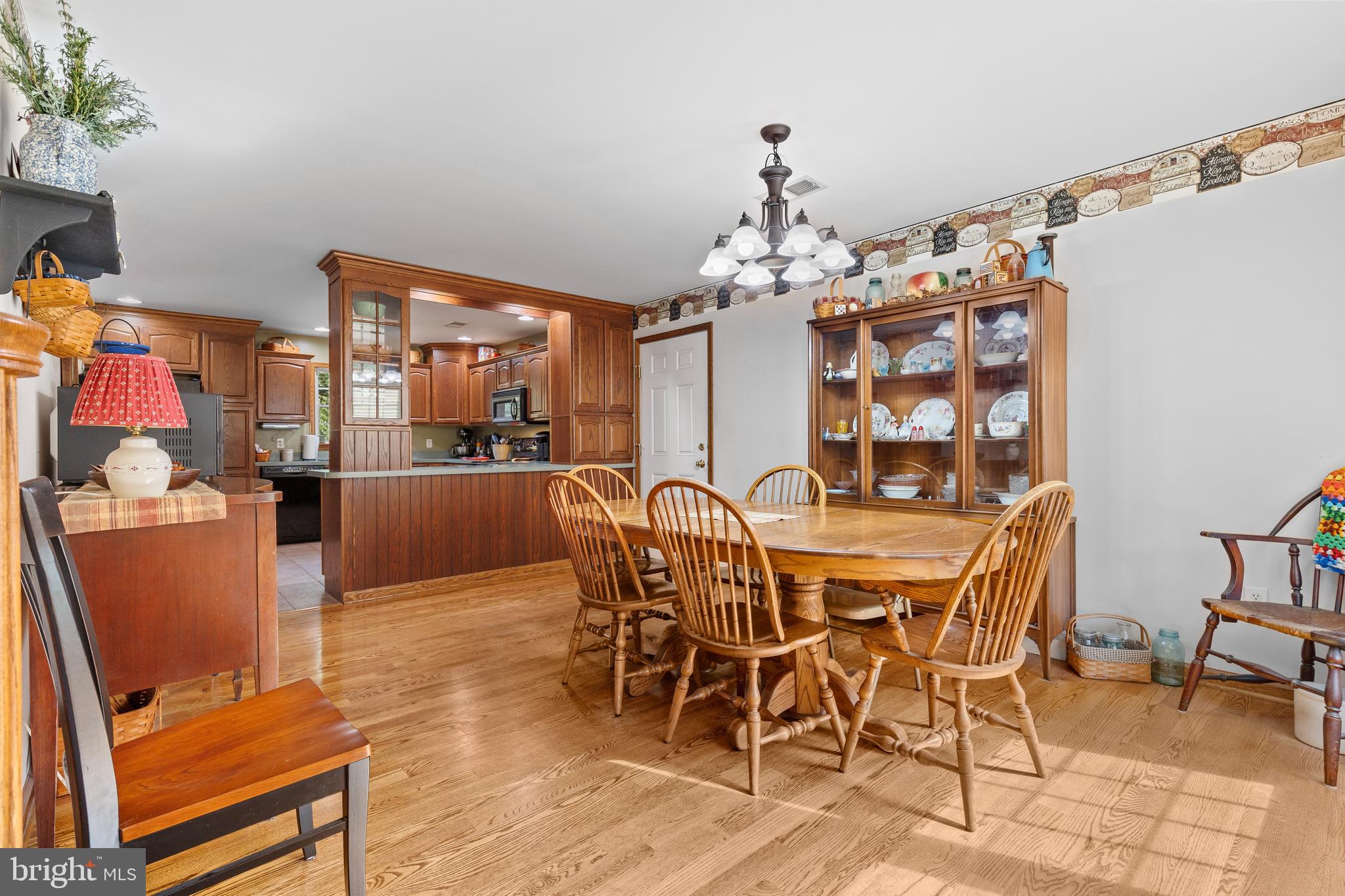 14731 Shimpstown Road Mercersburg, PA 17236 - Photo 11 of 52 a view of a dining room with furniture and chandelier