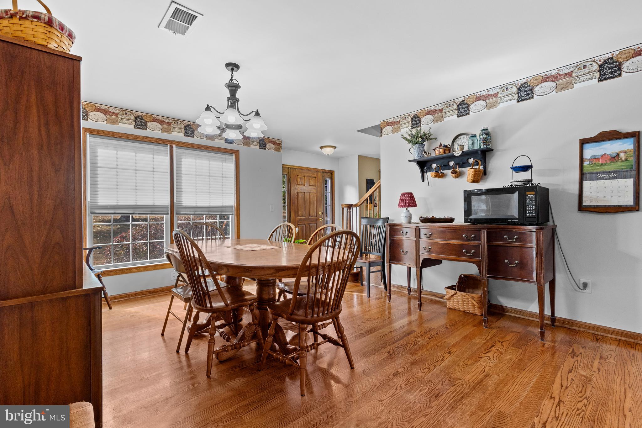 14731 Shimpstown Road Mercersburg, PA 17236 - Photo 12 of 52 a view of a dining room with furniture window and wooden floor