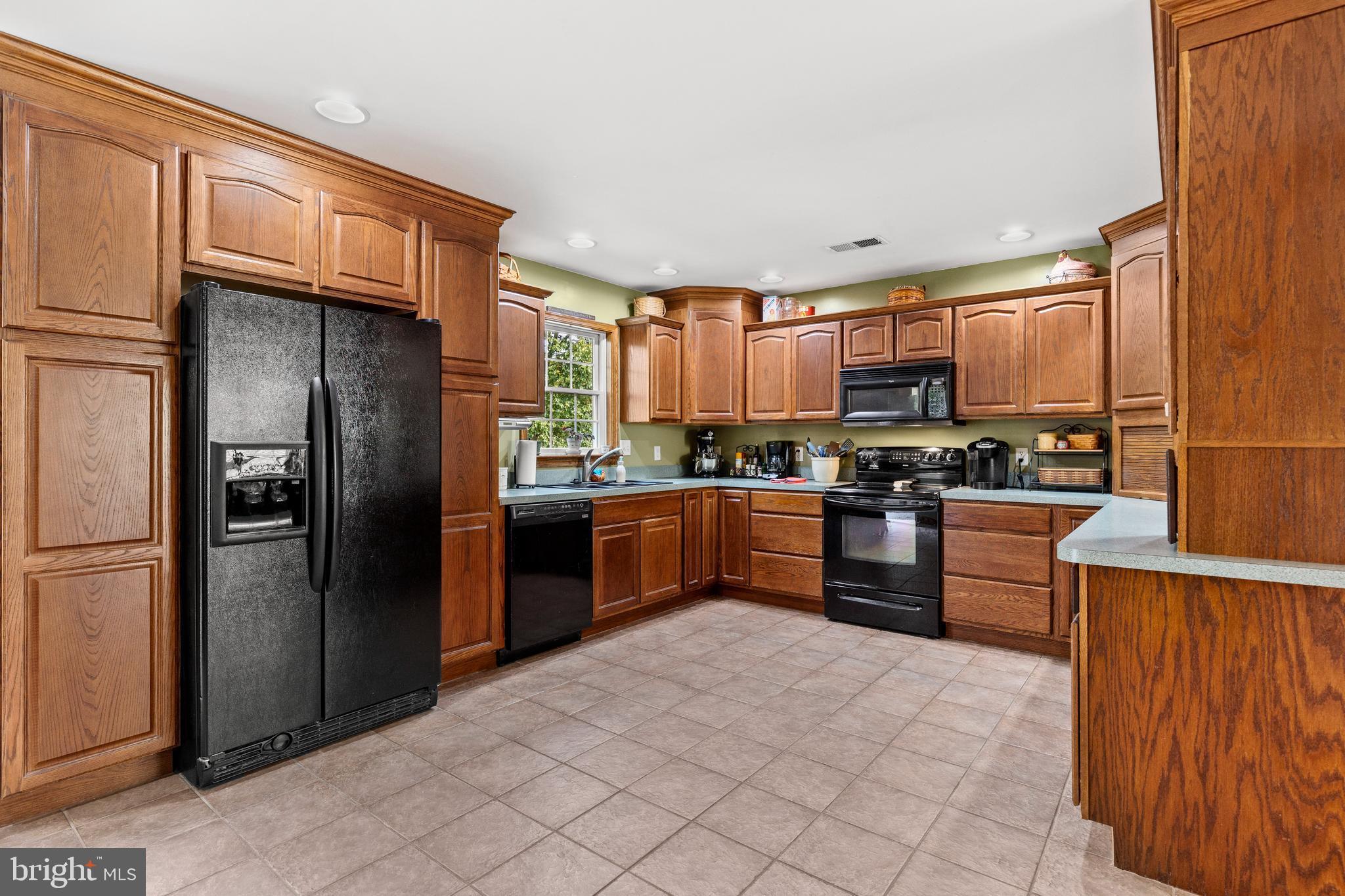 14731 Shimpstown Road Mercersburg, PA 17236 - Photo 13 of 52 a kitchen with stainless steel appliances granite countertop a refrigerator and a sink