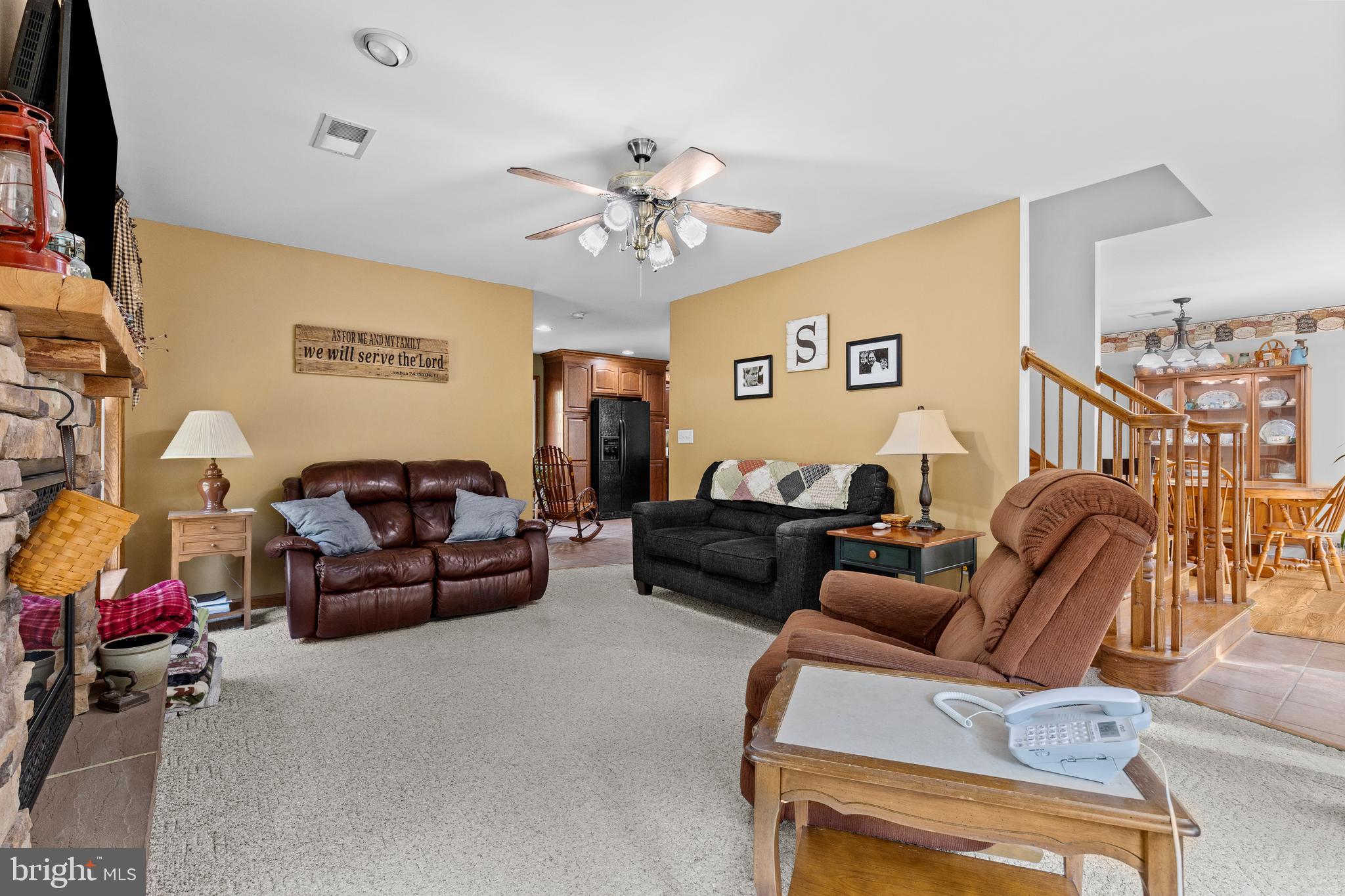 14731 Shimpstown Road Mercersburg, PA 17236 - Photo 20 of 52 a living room with furniture a ceiling fan and a window