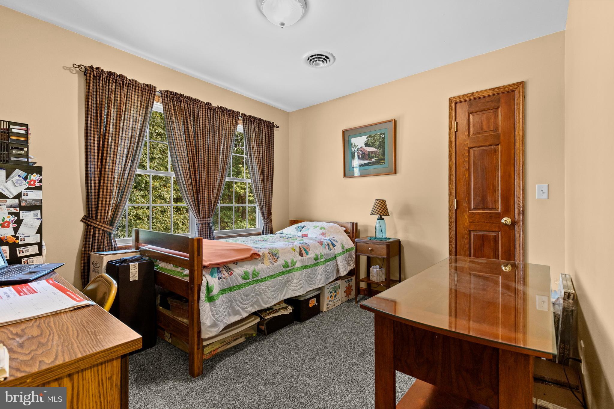 14731 Shimpstown Road Mercersburg, PA 17236 - Photo 26 of 52 a bed room with a bed and a desk