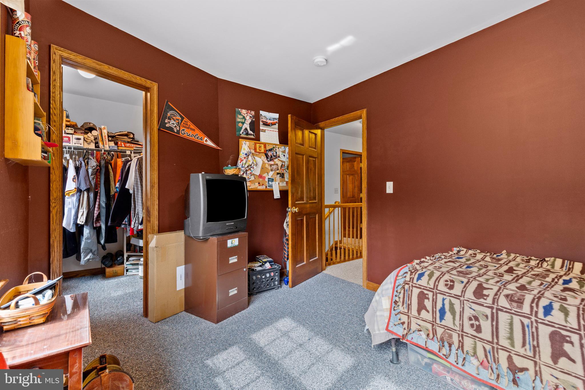 14731 Shimpstown Road Mercersburg, PA 17236 - Photo 29 of 52 a bedroom with a bed and a flat tv screen