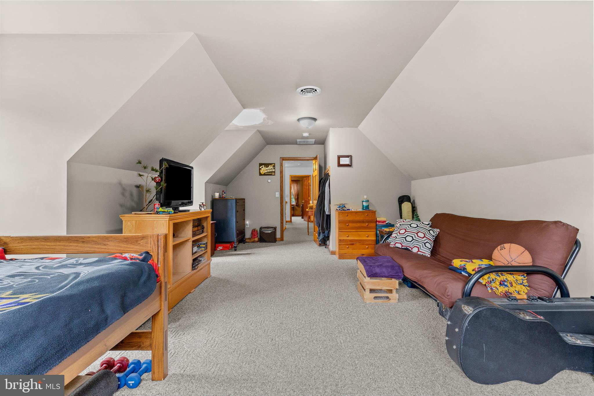 14731 Shimpstown Road Mercersburg, PA 17236 - Photo 31 of 52 a living room with furniture and a flat screen tv