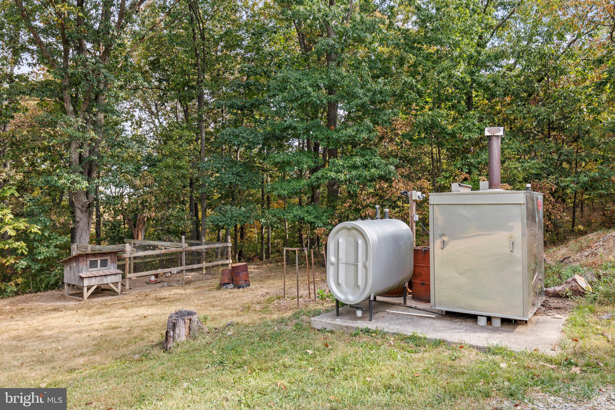 14731 Shimpstown Road Mercersburg, PA 17236 - Photo 36 of 52 a backyard of a house with table and chairs