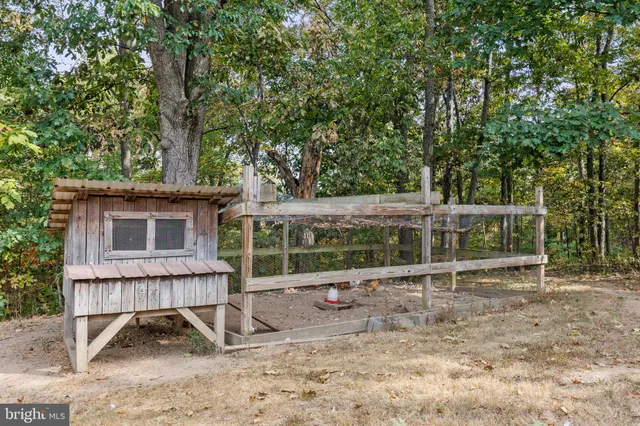 a aerial view of a house with table and chairs