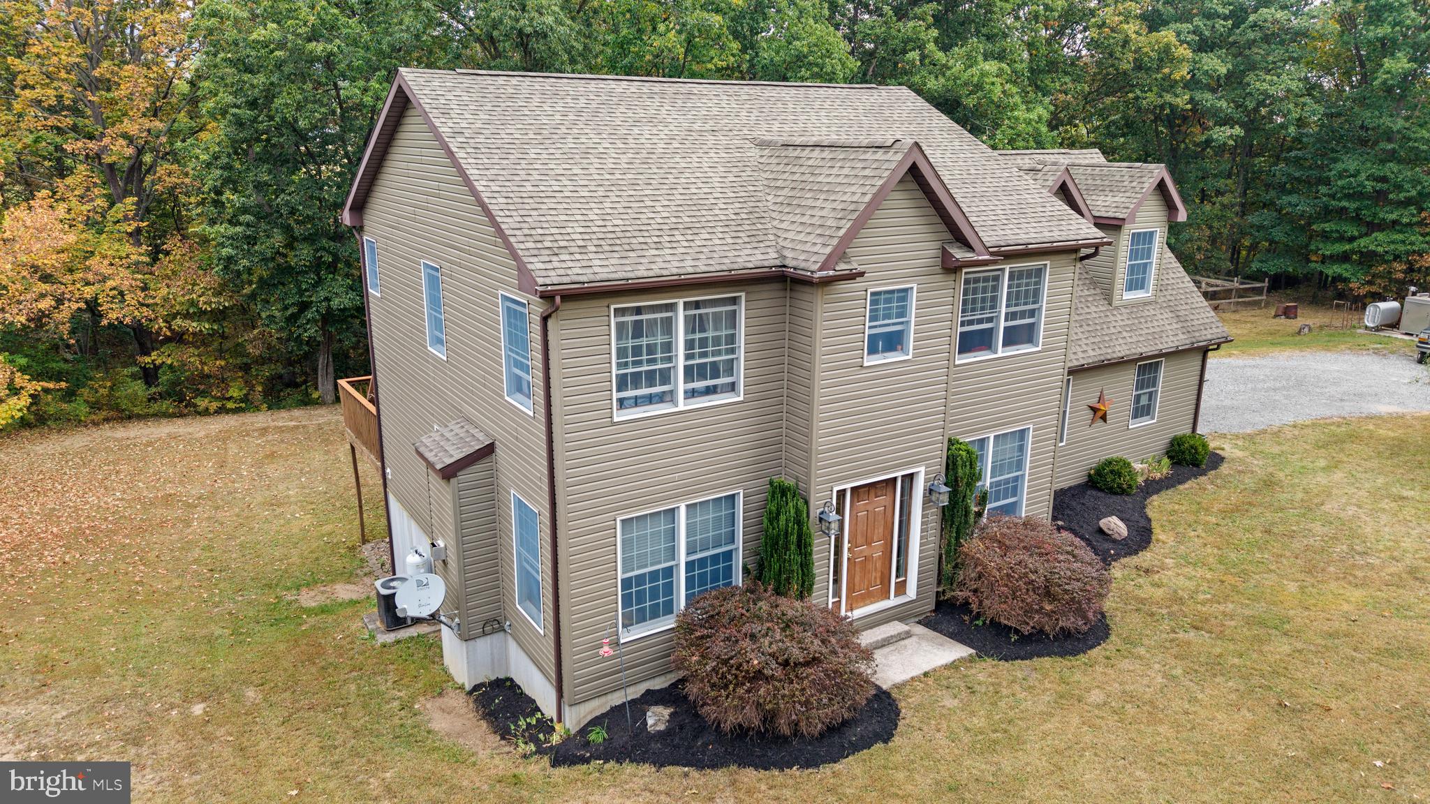 14731 Shimpstown Road Mercersburg, PA 17236 - Photo 39 of 52 a view of a house with a yard and sitting area