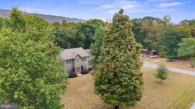 an aerial view of residential house with outdoor space